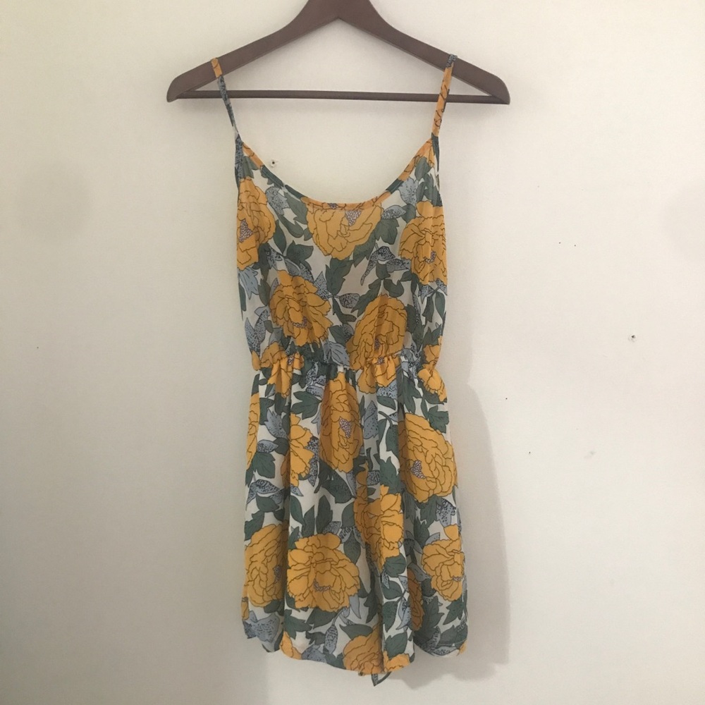 Flowy romper with yellow flowers